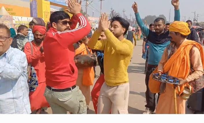 Devotees dancing and singing at Kumbh
